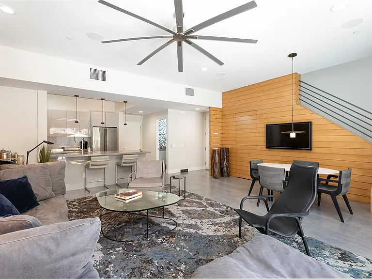 The great room with indoor dining area that seats six and an art television.