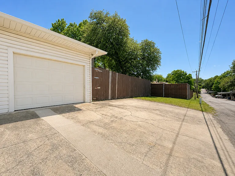 Driveway in alley can accommodate three cars