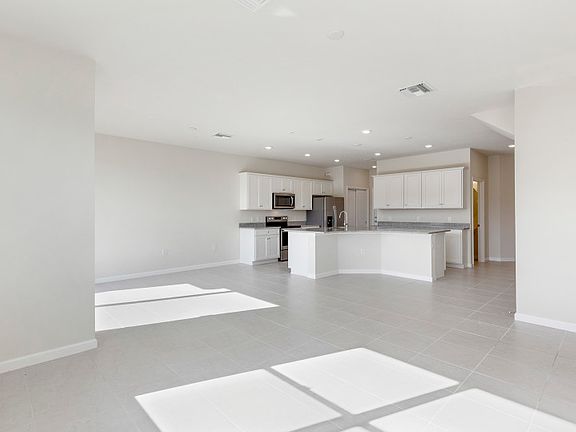 Model Representation Open-concept design with connecting tile floors in main living