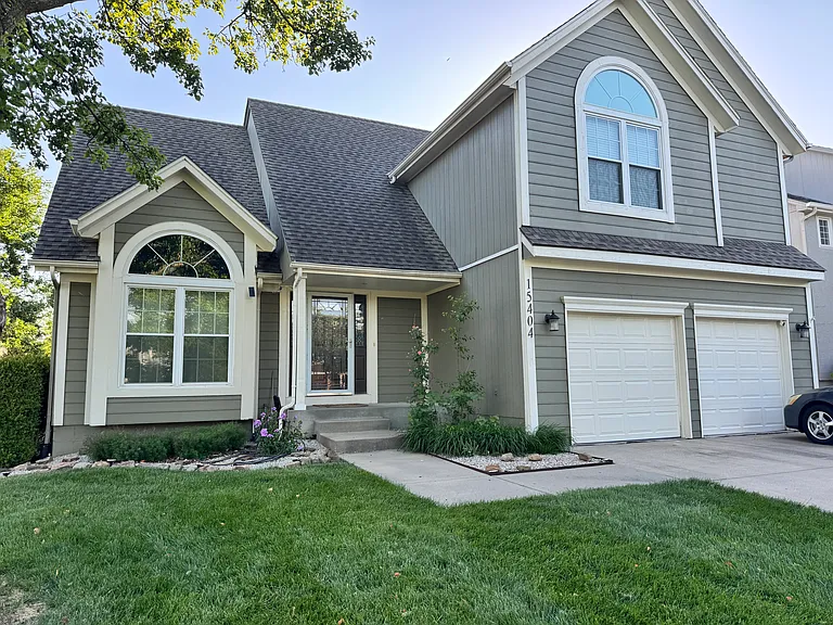 Beautifully maintained exterior with inviting curb appeal, mature landscaping, with 2-car garage.