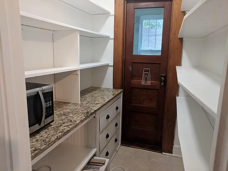 Pantry with granite countertops