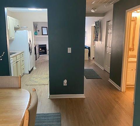 View from entranceway. Newly-installed flooring throughout entire home.