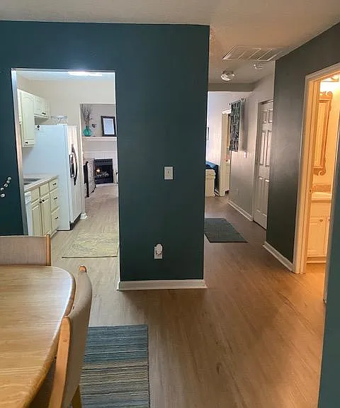 View from entranceway. Newly-installed flooring throughout entire home.