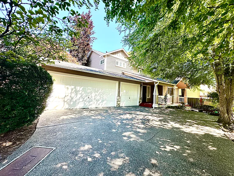 Quiet lane, corner lot. Driveway to huge 3 car garage.