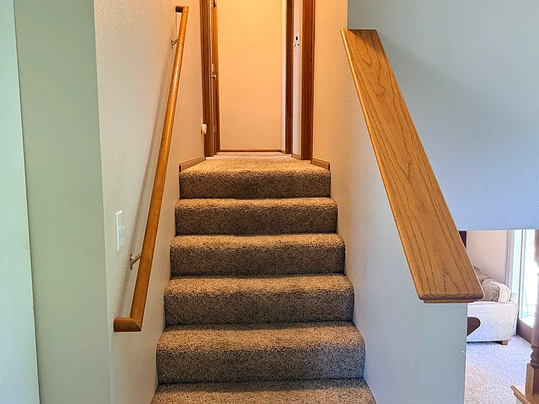 Stairs and hallway going upstairs to bedrooms