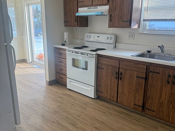 Newly remodeled Kitchen with a stove & refrigerator