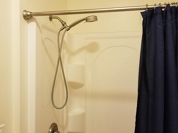 First floor bathroom shown with new fiberglass shower