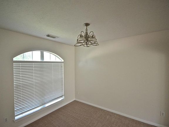 A LITTLE CLOSER VIEW OF THE FORMAL DINING ROOM BIG ENOUGH FOR THOSE SPECIAL HOLIDAY DINNERS.
