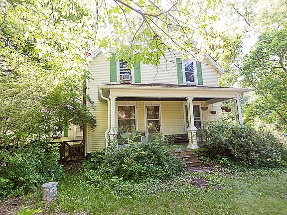 Nestled behind mature trees