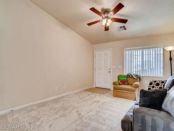 Step into this spacious living room with vaulted ceiling.  New carpet and tile throughout.