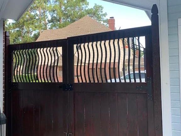 This gorgeous double gate with iron accents added 2020