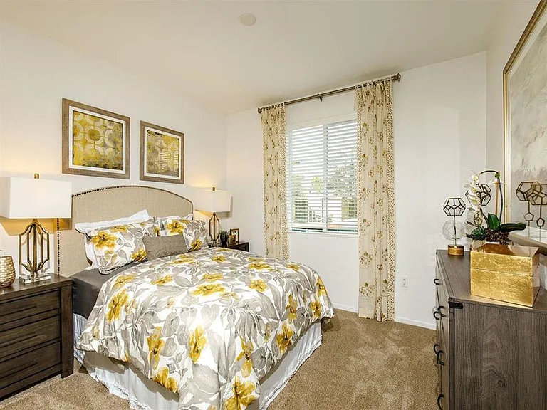 Master bedroom with a window on the left and can fit a queen bed with 2 nightstands and a dresser