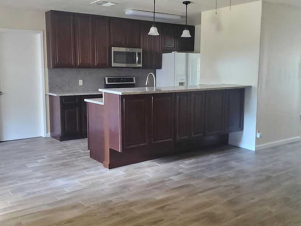 Kitchen with cabinets on both sides of the bar