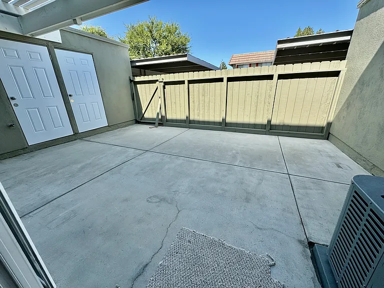 Large private patio with new fence and new storage closet doors!