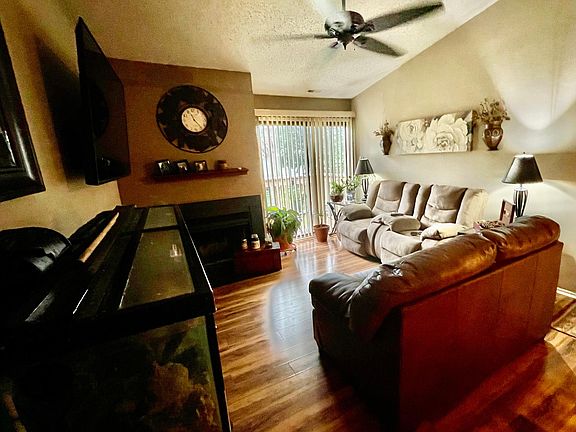 living room with fireplace & Balcony