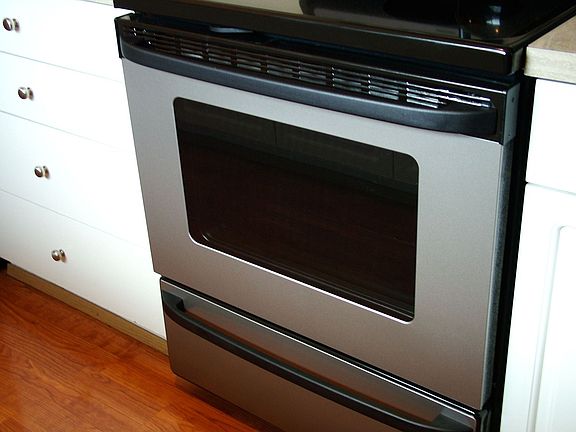 Stainless with flat cooktop.