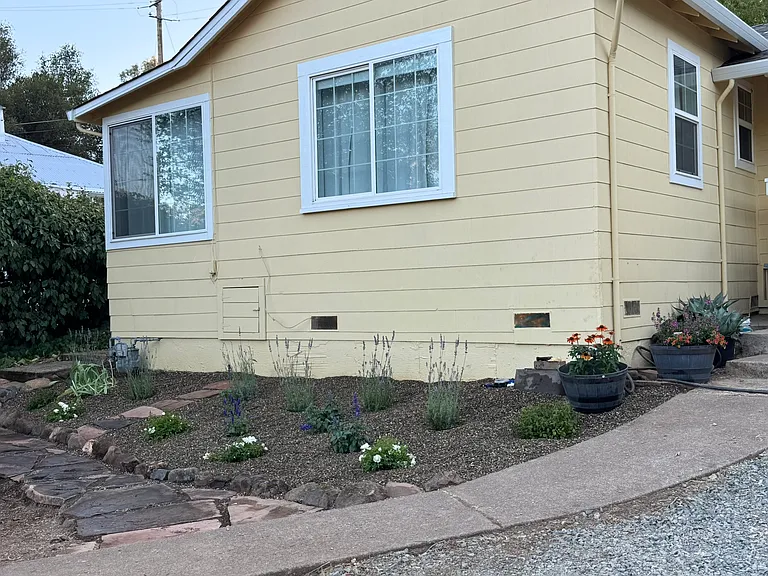 Front of the home. Garden is now full of beautiful roses, lavendar and salvia
