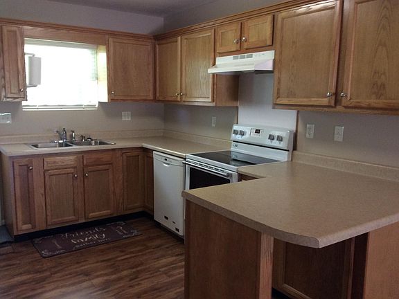 Kitchen with stove/dishwasher and bar area