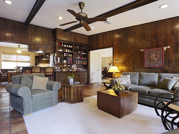  LARGE FAMILY ROOM LOOKS TO BREAKFAST BAR, BREAKFAST ROOM AND KITCHEN. DINING ROOM IS TO RIGHT IN PICTURE. BEAUTIFUL REFINISHED WOOD WALLS AND BEAMED CEILING.