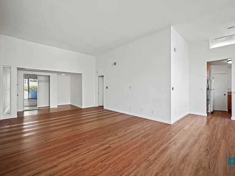 Front Entryway with a Hall Closet and Living Room