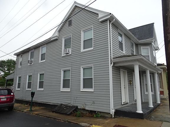 Side view of 2-story corner unit offered for rent.