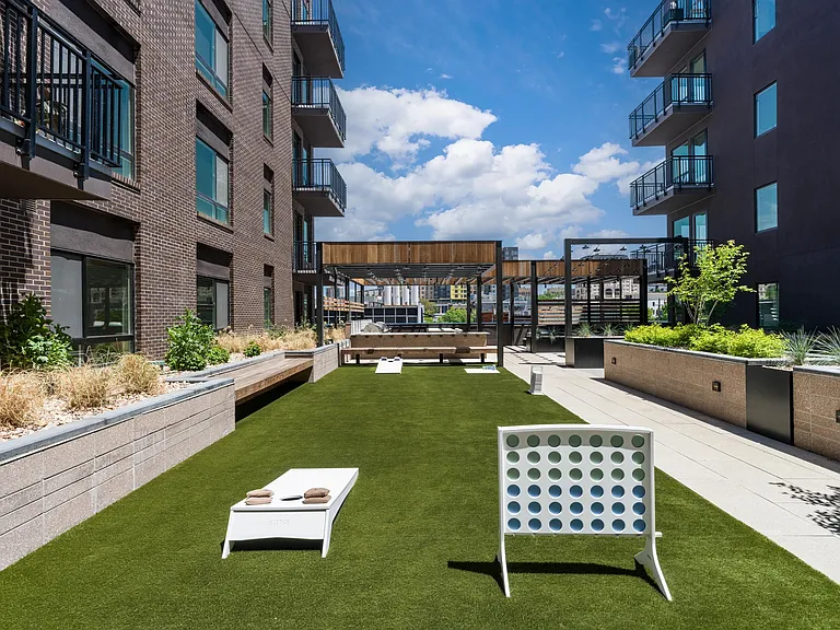 Take your fun to new heights on Modera Golden Triangle's rooftop gaming lawn. Enjoy open-air games, friendly competition, and stunning Denver views from above.