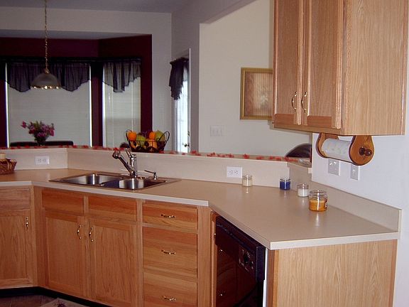 Kitchen with breakfast nook in background