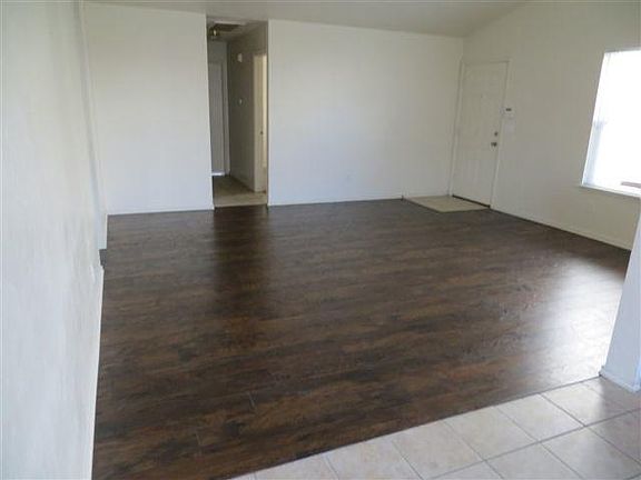 Laminate wood flooring in main living areas, makes cleaning