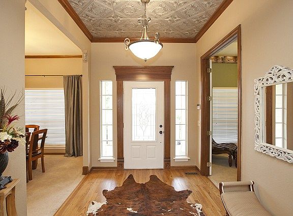 Entry has antiqued-tin ceiling