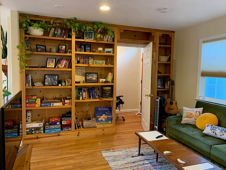 Living room #2 and built-in bookshelves; doorway leads to bonus office space