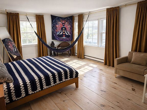 Spacious master with queen bed, dual closets, and great natural light.