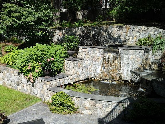 Three tiered stone fountain