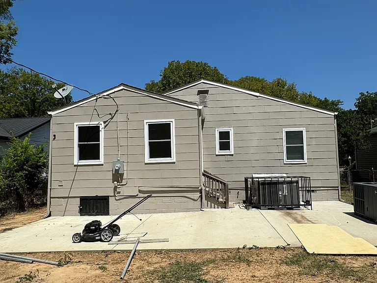 Rear of house features concrete patio for entertaining. Backyard being renovated to provide rear parking as well as a full wood privacy fence and back gate in 3-4 months