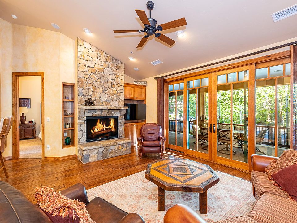 Living Room showing access to the back patio and master bedroom entrance on the left.