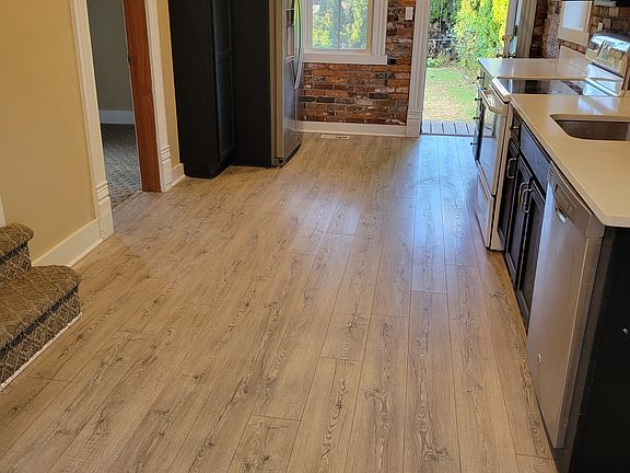 Front door view of kitchen and 1st level