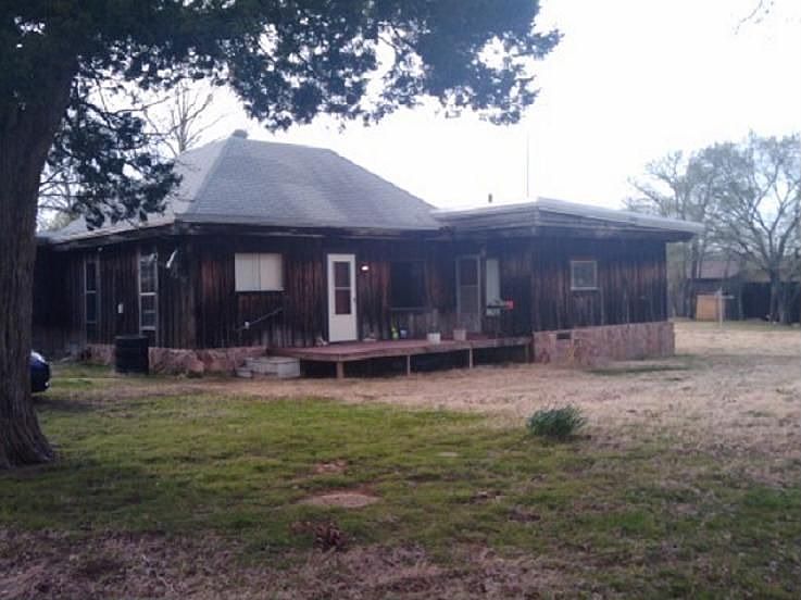 east side of the house that faces the road
