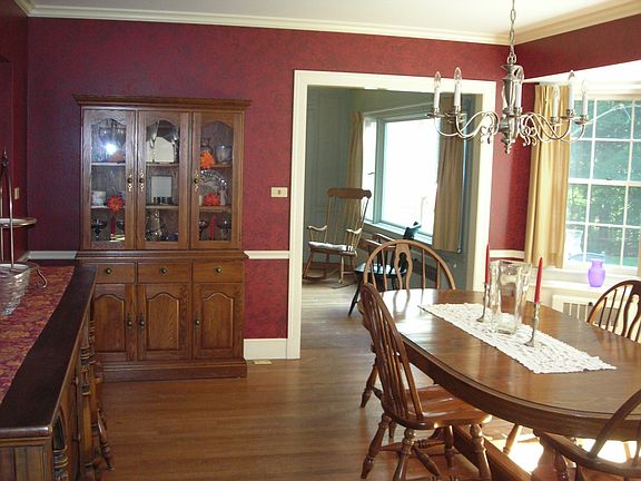 Large formal dining room with bay window and built ins 
