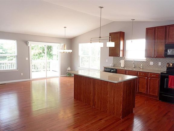 The vaulted Great Room has lovely real oak floors.
