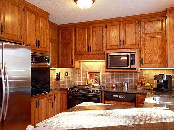 Stainless steel refrigerator, new hardwood flooring