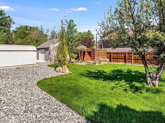 Yard between the house and garage. Lots of room for a bbq.