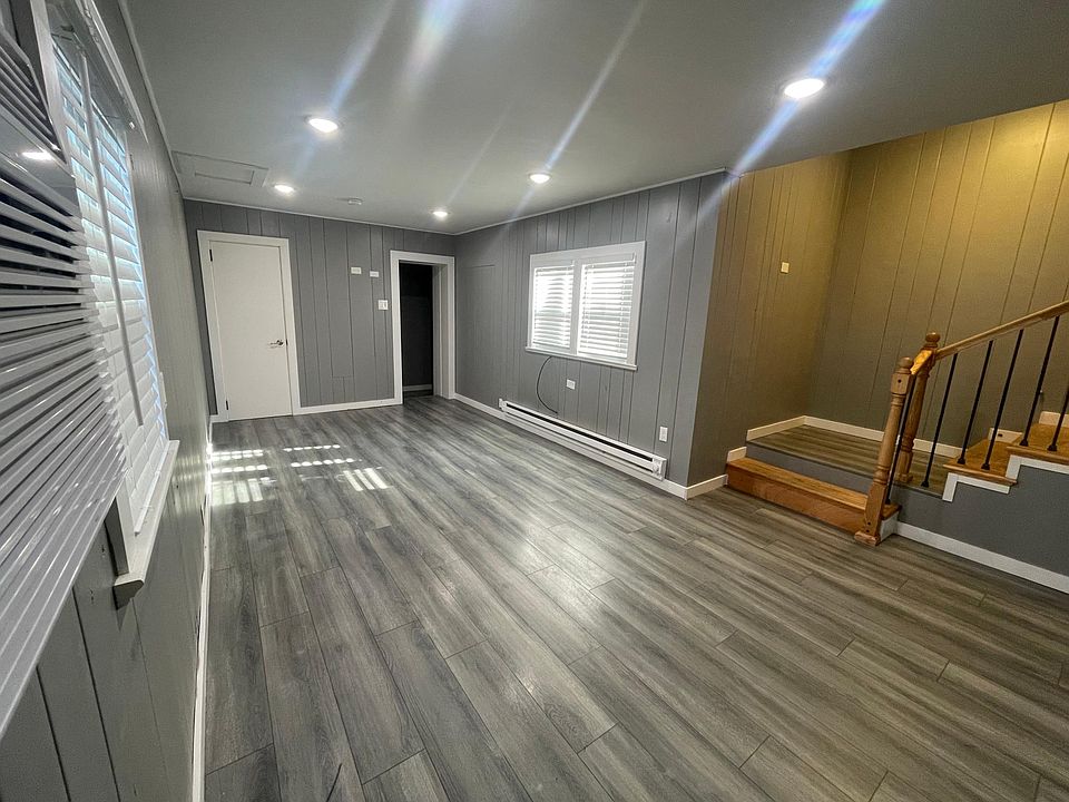 Living room with original built-ins and access to half bath