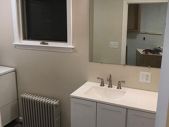 Bathroom with washer/dryer on-site