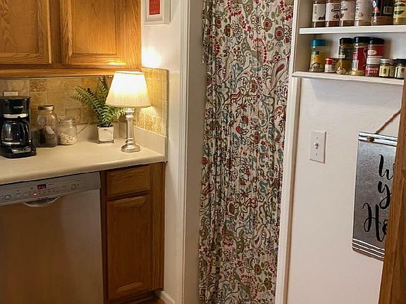 Kitchen. Laundry room is to the right (behind the curtain)