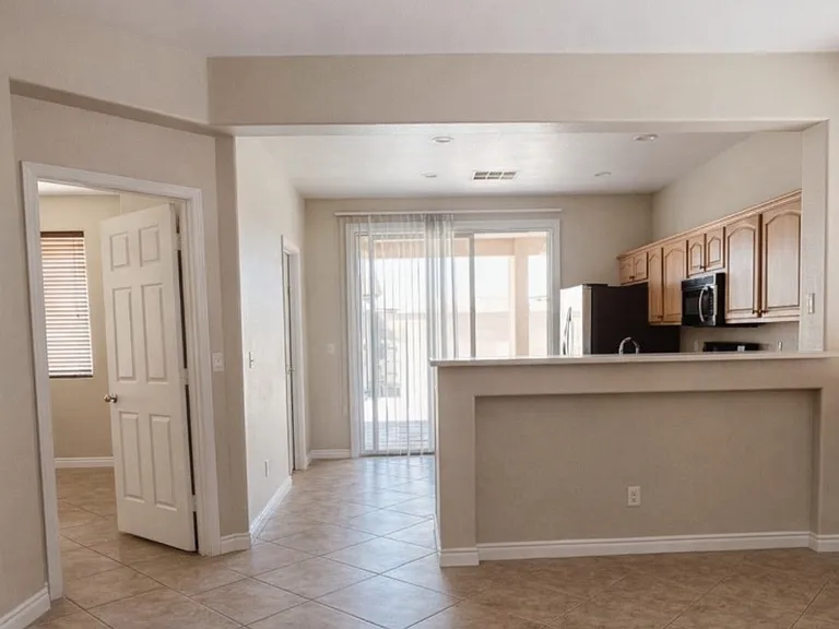 To the Left is Master Bedroom. The Sliding Glass Door in Kitchen Leads to Covered Patio and Low Maintenance Backyard