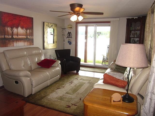 Living room with patio door just steps to lake.