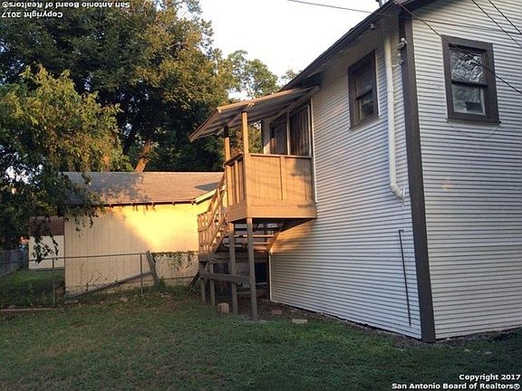 View of private entry at back and back yard.