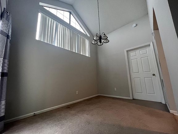 Dining Area with loft ceiling