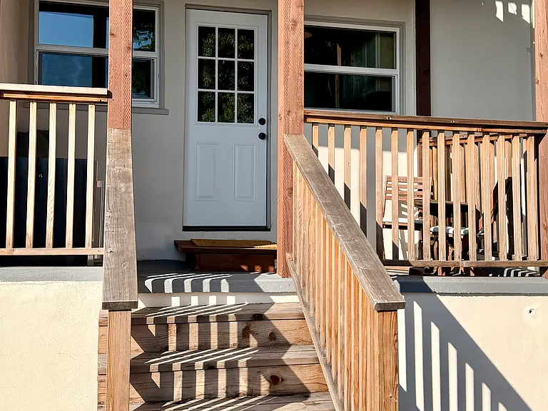 Private front entrance with balcony through shared backyard