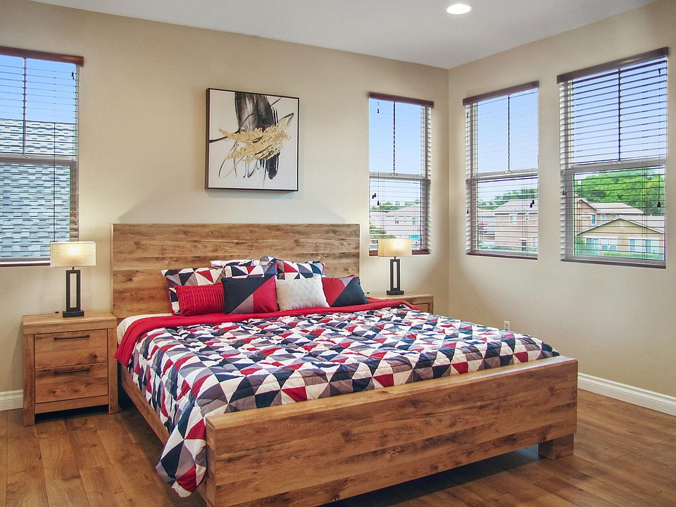 Master bedroom with an ensuite private bathroom with a double sink vanity, a walk-in shower, and a separate tub.