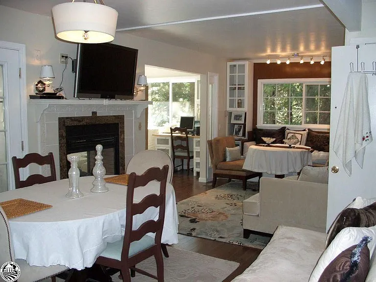 Living room/dining combo on main floor with two sided fireplace.